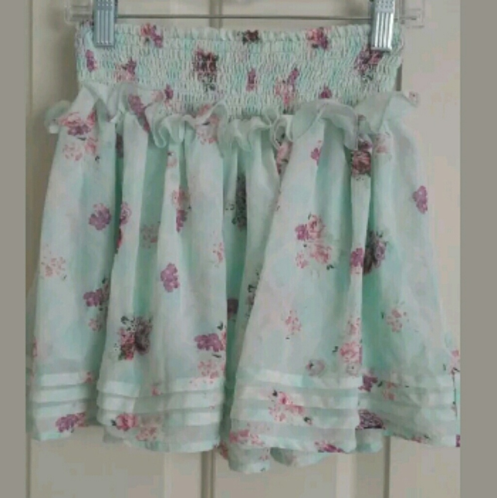 Girls size 10-12 short green skirt